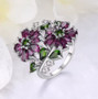 rhodolite garnet chrome diopside and white zircon rhodium over sterling silver flower cluster bypass ring shown in a lifestyle photo