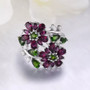front view of rhodolite garnet chrome diopside and white zircon rhodium over sterling silver flower cluster bypass ring
