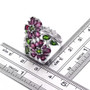 rhodolite garnet chrome diopside and white zircon rhodium over sterling silver flower cluster bypass ring shown for size comparison