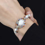 ethiopian opal and multi gemstone rhodium over sterling silver bracelet worn on a wrist