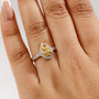 yellow sapphire and white zircon 18k yellow gold over sterling silver cluster ring worn on a hand