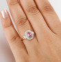 imperial topaz paraiba tourmaline and diamond halo ring in 10k rose gold worn on a hand