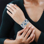 london blue topaz and swiss blue topaz blue apatite and zircon rhodium over sterling silver cuff bracelet worn on a wrist