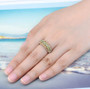 peridot and citrine band ring in rhodium over sterling silver worn on a hand