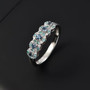 alexandrite paraiba tourmaline and diamond halo band ring in 950 platinum shown in a lifestyle photo