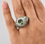 green apatite and white zircon rhodium over sterling silver ring worn on a hand