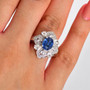 blue kyanite and white zircon rhodium over sterling silver ring worn on a hand