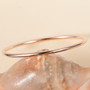 5mm 14k rose gold bangle bracelet 18 30g shown in a lifestyle photo