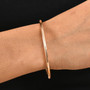 5mm 14k rose gold bangle bracelet 18 30g worn on a wrist