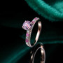 kunzite pink sapphire and moissanite 18k rose gold over sterling silver ring shown in a lifestyle photo