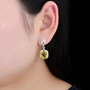 yellow fluorite and white zircon rhodium over sterling silver earrings worn on the ear