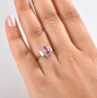 padparadscha sapphire paraiba tourmaline and diamond marquise halo ring in 10k yellow gold worn on a hand
