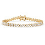 white zircon tapered baguette tennis bracelet in 18k yellow gold over sterling silver