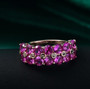 lab pink and white sapphire band ring in 18k rose gold over sterling silver shown in a lifestyle photo