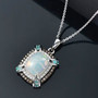 ethiopian opal paraiba tourmaline champagne and white diamond necklace in rhodium over sterling silver shown in a lifestyle photo