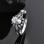 aquamarine blue sapphire and zircon halo ring in rhodium over sterling silver shown in a lifestyle photo