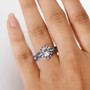 aquamarine blue sapphire and zircon halo ring in rhodium over sterling silver worn on a hand