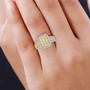 yellow and white diamond cluster halo ring in 14k yellow gold worn on a hand