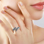 rhodium over sterling silver wing bypass ring worn on a hand