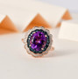 amethyst blue and white diamond double halo ring in 18k rose gold over sterling silver shown in a lifestyle photo