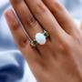 opal chrome diopside and zircon trilogy ring in 18k yellow gold and rhodium over sterling silver worn on a hand