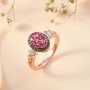 mahenge pink spinel brown and white diamond cluster ring in 18k rose gold and black and white rhodium over sterling silver shown in a lifestyle photo