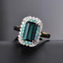 indicolite tourmaline paraiba tourmaline and diamond double halo ring in 950 platinum shown in a lifestyle photo