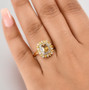 yellow zircon yellow sapphire and white zircon cushion halo ring in 18k yellow gold over sterling silver worn on a hand