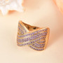 lab grown purple sapphire crossover ring in 18k yellow gold over sterling silver shown in a lifestyle photo