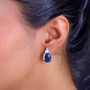 shadowkite peacock stud earrings in rhodium over sterling silver worn on the ear