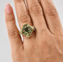 green apatite and white zircon cluster ring in 18k yellow gold over sterling silver worn on a hand