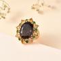 chocolate sapphire citrine and chrome diopside halo cocktail ring in 18k yellow gold over sterling silver shown in a lifestyle photo