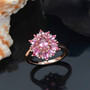 pink tourmaline and white zircon floral cluster ring in 18k rose gold over sterling silver shown in a lifestyle photo