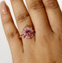 pink tourmaline and white zircon floral cluster ring in 18k rose gold over sterling silver worn on a hand