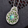 ethiopian opal chrome diopside and zircon flower halo pendant necklace in rhodium over sterling silver shown in a lifestyle photo