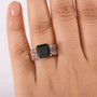 black spinel and rhodolite garnet ring in rhodium over sterling silver worn on a hand