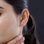 diamond cut ball stud earrings in 10k yellow gold worn on the ear