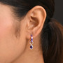 amethyst and enamel earrings in rhodium over sterling silver worn on the ear