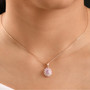 kunzite pink sapphire and moissanite oval double halo pendant necklace in 18k rose gold over sterling silver worn around the neck
