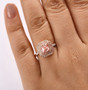 lab pink and white diamond asscher cut double halo ring in 10k rose gold worn on a hand