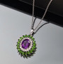 amethyst chrome diopside and zircon double halo pendant necklace in rhodium over sterling silver shown in a lifestyle photo