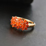 fire opal cluster ring in 18k yellow gold over sterling silver shown in a lifestyle photo