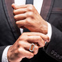 fire opal and zircon gents ring in rhodium over sterling silver worn on a hand
