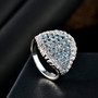 aquamarine and white zircon cluster ring in rhodium over sterling silver shown in a lifestyle photo