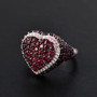 anthill garnet and zircon heart cluster ring in rhodium over sterling silver shown in a lifestyle photo