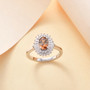 andalusite and moissanite halo ring in rhodium over sterling silver shown in a lifestyle photo