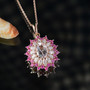 morganite moissanite and pink sapphire pendant necklace in 18k rose gold over sterling silver shown in a lifestyle photo
