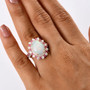 ethiopian opal pink sapphire and moissanite halo ring in 18k rose gold over sterling silver worn on a hand