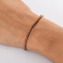 champagne diamond tennis bracelet in 18k rose gold over sterling silver worn on a wrist