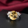 yellow labradorite and white zircon clover ring in rhodium over sterling silver shown in a lifestyle photo